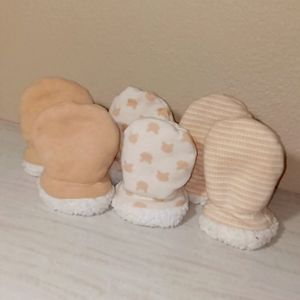 Cream colored mittens. 3 pairs.